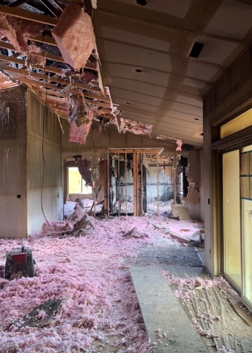 Damaged interior with exposed building materials after a fire